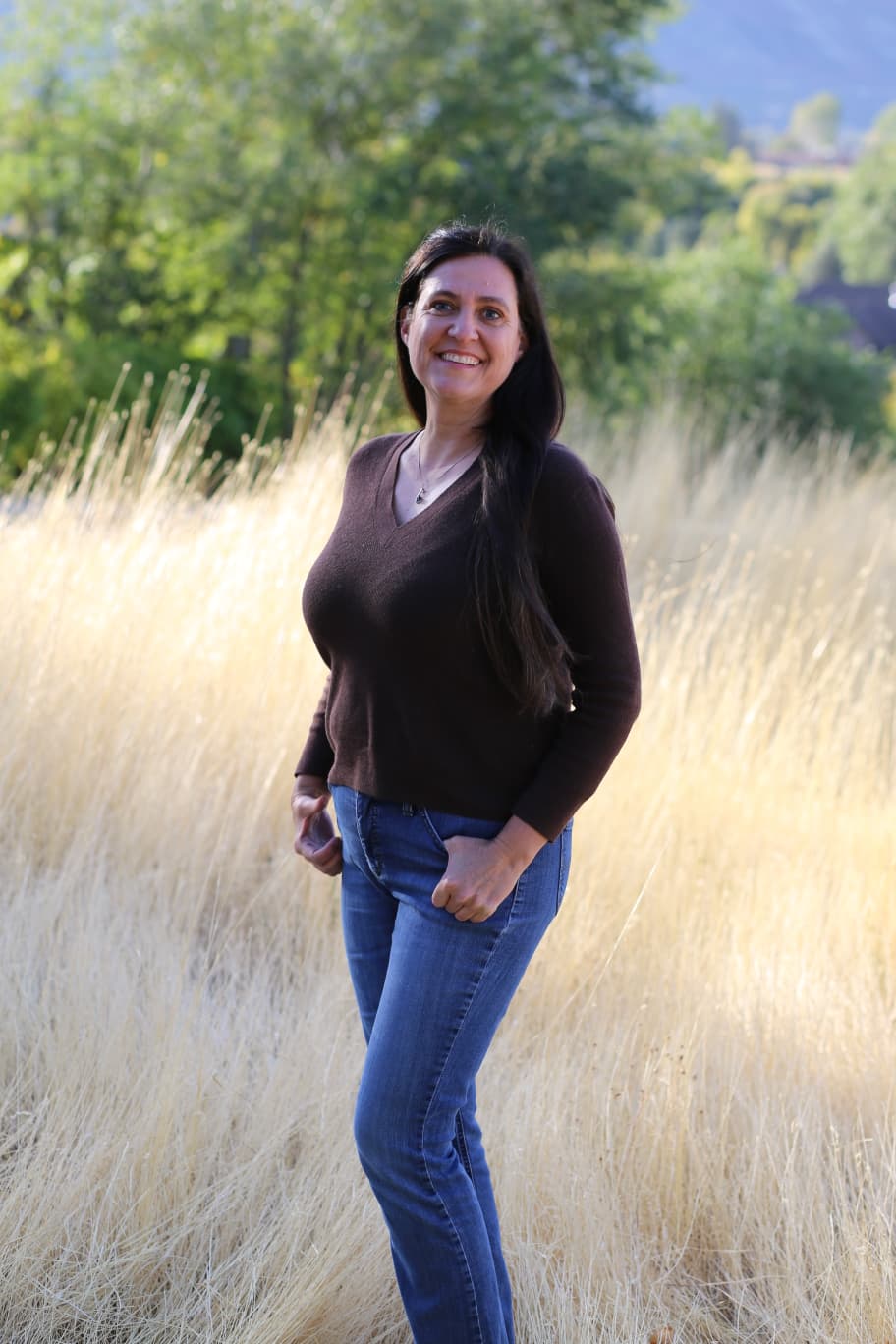 Dr. Martinez standing in a field